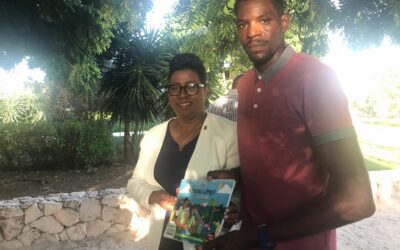 Minister receives GreenKidz book